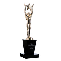 STAT02: Gold oscar figurine with star on black crystal base