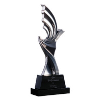 STAT03: Silver figurine on black crystal base