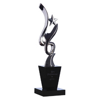 STAT04: Silver figurine on black crystal base